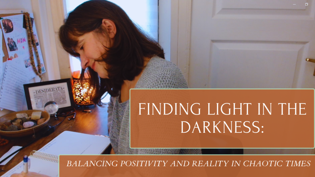 User writing in a Danielle Laporte planner at desk reflecting on the theme of finding light in darkness amidst chaos